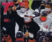  ?? STACY REVERE — GETTY IMAGES ?? Buccaneers coach Bruce Arians celebrates with his team after beating the Packers in the NFC championsh­ip game.