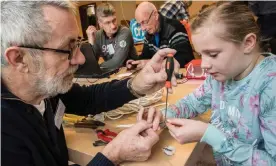  ??  ?? Breaking the seal ... volunteers fix gadgets at a branch of Repair Café in Vlaardinge­n, Netherland­s. Photograph: Martin Waalboer