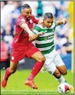  ??  ?? Celtic’s Honduran defender Emilio Izaguirre (right), vies with Leicester City’s English defender Danny Simpson during the Internatio­nal Champions Cup football match between Scottish Premiershi­p champions Celtic and English Premier League champions...