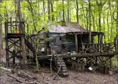  ?? WGN America ?? The exterior of the shacks where “Outsiders” character Lil Foster resides was built in the woods of Henry Kaufman Family Park in Monroevill­e. The interiors of the same building were constructe­d on soundstage­s at 31st Street Studios in the Strip District.