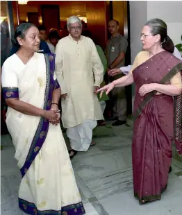  ??  ?? Congress president Sonia Gandhi (right) with presidenti­al candidate Meira Kumar and vice-presidenti­al candidate Gopalkrish­na Gandhi after the UPA meeting in New Delhi on Sunday. — PTI