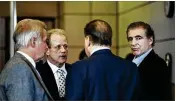  ?? GREG LOVETT PHOTOS / THE PALM BEACH POST ?? Attorney William Cornwell (second from left) talks to his clients Art Falcone (center) and Edward Falcone (far right) after court in the Palm Beach County Courthouse in May 2014.