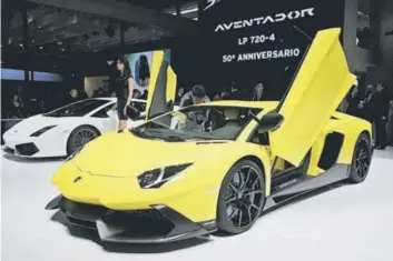  ??  ?? LIKELY TO SLOW: A Lamborghin­i Adventador sports car is seen on display on media day at the Shanghai auto show in Shanghai. The group expects to achieve about the same sales numbers as last year, although the luxury super sports cars market in China is...