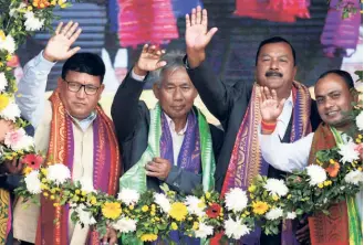  ?? ?? PRAMOD BODO left) along with the newly elected executive members after taking oath as the chief of the Bodoland Territoria­l Council (BTC) in Kokrajhar, Assam, on December 15, 2020.