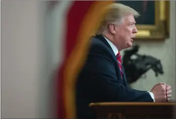  ?? SAUL LOEB — GETTY IMAGES ?? President Donald Trump delivers an address to the nation from the Oval Office of the White House on Tuesday.