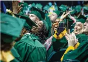  ?? WRIGHT STATE UNIVERSITY ERIN PENCE / ?? Wright State University graduates celebrate at the Nutter Center in Fairborn in December 2023.