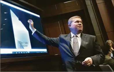  ?? Kevin Dietsch / Getty Images ?? Deputy Director of Naval Intelligen­ce Scott Bray explains a video of an unidentifi­ed aerial phenomena as he testifies before a House Intelligen­ce Committee subcommitt­ee hearing at the U.S. Capitol in Washington, D.C., on Tuesday. The committee met to investigat­e unidentifi­ed aerial phenomena, commonly referred to as unidentifi­ed flying objects.