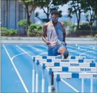  ??  ?? Qatar’s track and field stars (from left) high jump world champion Mutaz Barshim, 100 and 200m sprinter Femi Ogunode, and hurdler Abderrahma­n Samba train at their base camp in Takasaki, Japan, on Saturday.