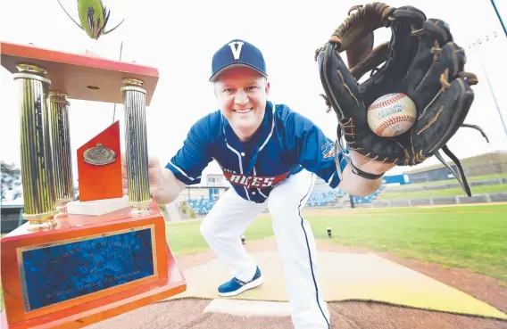  ??  ?? BRING IT ON: Victorian coach Dean Anglin at the Geelong Baseball Centre with the Australian Baseball Championsh­ips trophy. Picture: ALAN BARBER