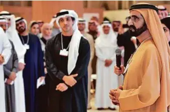  ?? WAM ?? Shaikh Mohammad addressing the Retreat of Resolve in Abu Dhabi. Shaikh Mansour Bin Zayed Al Nahyan, Deputy Prime Minister and Minister of Presidenti­al Affairs, is with him.