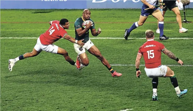  ?? Picture: ESA ALEXANDER ?? Springbok Makazole Mapimpi on his way to his try against British & Irish Lions, left, Anthony Watson and Stuart Hogg, during the Castle Lager Lions Series at Cape Town Stadium yesterday.