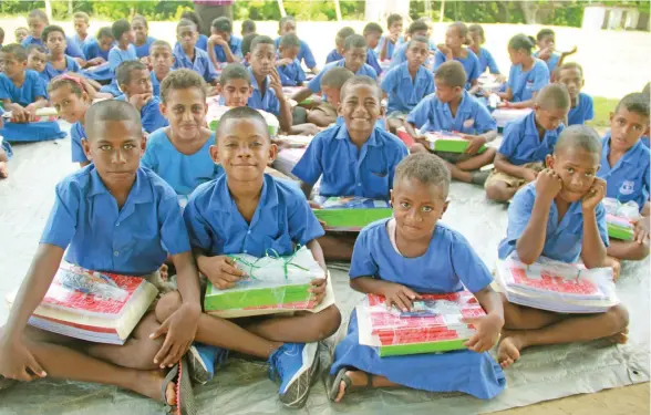  ??  ?? Students of Somolevu Catholic Primary School in the Yasawa Group after receiving their back-to-school packs.