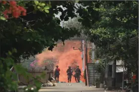  ?? (AP) ?? Soldiers approach anti-coup protesters Tuesday during a demonstrat­ion in Rangoon, Burma.