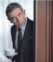  ?? FOTO: DPA ?? Rowan Atkinson soll als Johnny English einen Cyberangri­ff aufklären.