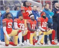  ?? MARCIO JOSE SANCHEZ/ASSOCIATED PRESS ?? A group of San Fransciso 49ers kneel during the national anthem last December. With the policy to ban onfield protests during the anthem on hold, no one is sure what to expect.