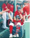  ?? GETTY IMAGES FILE PHOTO ?? Hunter Renfroe rides the home-run laundry cart through the dugout in August.