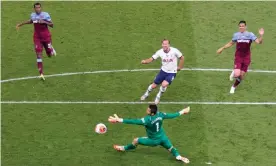  ??  ?? Harry Kane slots to the ball past Lukasz Fabiansk to score Spurs second goal against West Ham. Photograph: Richard Pelham/NMC Pool