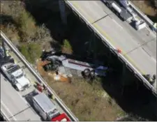  ?? DAN ANDERSON — THE ASSOCIATED PRESS ?? Rescue crews work at the scene of a deadly charter bus crash on Tuesday in Loxley, Ala. The bus carrying Texas high school band members home from Disney World plunged into a ravine before dawn Tuesday.