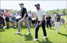  ?? Andy Lyons/Getty Images ?? Tiger Woods walks the course during a practice round Monday at Valhalla Golf Club in Louisville, Ky.