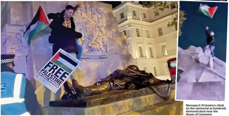  ?? ?? Disrespect: Protesters climb on the memorial as hundreds demonstrat­ed near the House of Commons