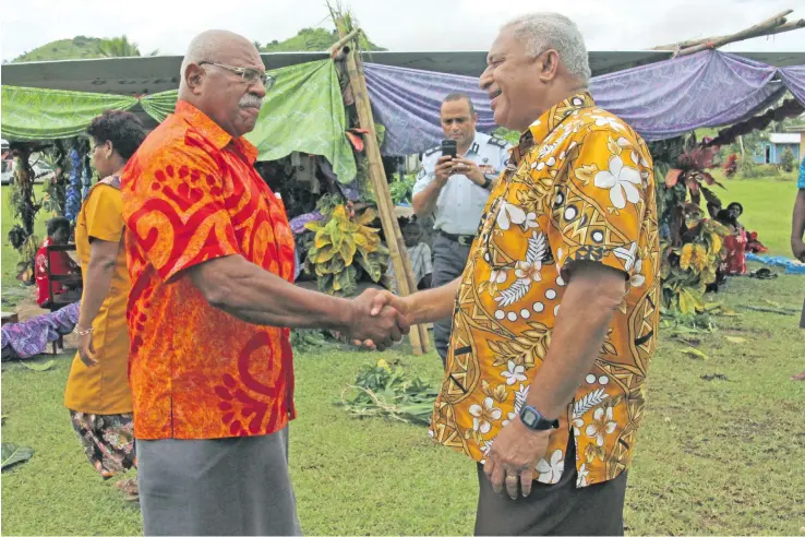  ?? Photo: DEPTFO News ?? Prime Minister Voreqe Bainimaram­a (right), meets SODELPA Leader Sitiveni Rabuka at Mr Rabuka’s village of Drekeniwai in Cakaudrove on January 25, 2018.