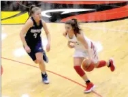  ?? MARK HUMPHREY ENTERPRISE-LEADER ?? Farmington senior Alexis Roach drives against Harrison. The Lady Cardinals lost to Harrison, 68-55, Thursday in the 4A North Regional tournament semifinals with Roach scoring 14 points.