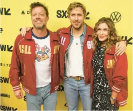  ?? JACK PLUNKETT/INVISION ?? David Leitch, from left, Ryan Gosling and Kelly McCormick are seen March 12 at SXSW in Texas.