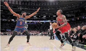  ?? ELSA GETTY IMAGES FILE PHOTO ?? DeMar DeRozan of the Chicago Bulls looks to take a shot as Precious Achiuwa of the Knicks defends at Madison Square Garden in New York on Sunday.