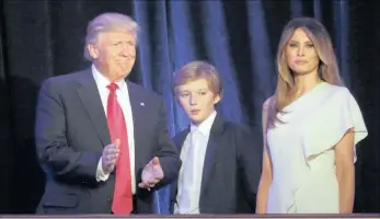  ??  ?? US president-elect Donald Trump with his son Barron and wife Melania at his election-night rally in Manhattan.