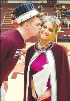  ?? Westside Eagle Observer/RANDY MOLL ?? Gentry High School senior Dylan Kilgore, chosen coronation king, kisses Gentry senior Madison Ward after she was crowned coronation queen during special ceremonies at Gentry High School on Friday night, Jan. 11.