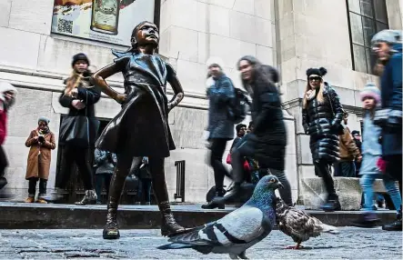  ??  ?? Role model: The hands-on-hips bronze statue of Fearless Girl inspired millions with a message of female empowermen­t. — Bloomberg