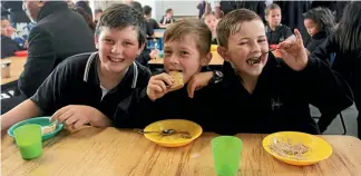  ?? PHOTO: FAIRFAX NZ ?? Preston Barbarich, Hamish Clark and Riley Noonan at the Breakfast Club at Morrinsvil­le Primary School.