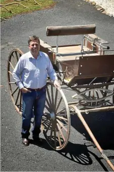  ?? Photos: Bev Lacey ?? BACK TO THE FUTURE: Ken Bullen with one of the horse-drawn carts that will go under the hammer at auction on Sunday.