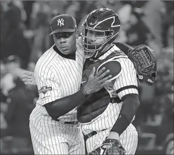  ?? FRANK FRANKLIN II/AP PHOTO ?? Yankees relief pitcher Aroldis Chapman celebrates with catcher Gary Sanchez after the Yankees beat Houston on Friday, 4-1, in Game 5 of the American League Championsh­ip Series at Yankee Stadium.