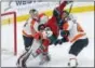  ?? JIM MONE — THE ASSOCIATED PRESS ?? Minnesota Wild’s Jared Spurgeon, center, gets squeezed between Flyers goalie Steve Mason, left, and defenseman Andrew MacDonald during the third period Thursday.