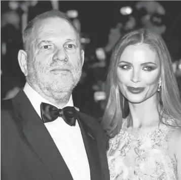  ??  ?? Harvey Weinstein and Georgina Chapman have been married since 2007. In an interview published Thursday, Weinstein told the New York Post she is “100% behind me.”