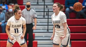  ?? Alexandra Wimley/Post-Gazette ?? Rochester’s Corynne Hauser (11) and Kallista Seybert (35) celebrate winning the Class 1A WPIAL championsh­ip March 15. Hausern and Alexis Robinson (not pictured) are in sync headed into the PIAA semifinals.