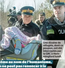  ??  ?? Une dizaine de réfugiés, dont ce poupon, ont été intercepté­s par la GRC à Hemmingfor­d lundi.