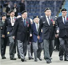  ??  ?? Seeing the veterans company march into the Brandt Centre on Sunday provided a history lesson for some of the young people in attendance.