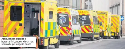  ??  ?? Ambulances outside a hospital in London which has seen a huge surge in cases