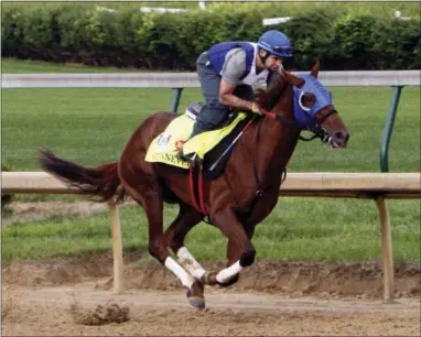  ?? GARRY JONES — THE ASSOCIATED PRESS ?? Kentucky Derby hopeful Gunnevera works out under exercise rider Victor O’Farrel at Churchill Downs on Friday.