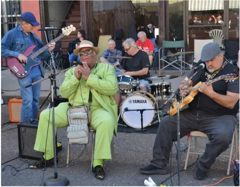  ?? (Special to The Commercial/Richard Ledbetter) ?? The No. 5-rated living blues harmonica player Blind Mississipp­i Morris (center front row) joined guitarist Jess Hoggard to perform on Cherry Street in Helena-West Helena on Saturday.