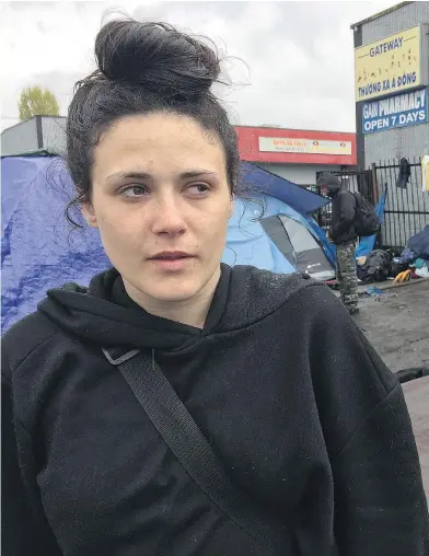  ?? JENNIFER SALTMAN/PNG ?? Alexandra Sayers stands by her tent and talks about living on 135A Street, also known as ‘The Strip.’ The 21-year-old, who has an addiction, has been living on The Strip in Surrey for about a year. ‘It’s scary being out here,’ she says.