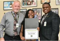  ?? (Pine Bluff Commercial/I.C. Murrell) ?? Watson Chapel High School freshman Diamon Parks (center) was honored as a Wildcat Warrior for March. She is pictured with Watson Chapel School District Superinten­dent Tom Wilson and high school Principal Henry Webb.