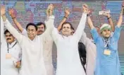  ?? PTI ?? Congress president Rahul Gandhi flanked by state unit president Kamal Nath (L) and campaign chief Jyotiradit­ya Scindia (R).