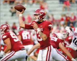  ?? THOMAS GRANING/AP ?? Arkansas quarterbac­k Feleipe Franks, 13, releases a pass past Mississipp­i State linebacker Aaron Brule, 3, during the first half of an NCAA college football game in Starkville, Mississipp­i, Saturday, Oct. 3.