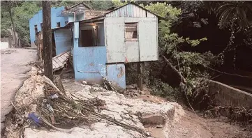  ?? ADRIAN FRATER ?? Three quarters of this house was destroyed by flood waters.