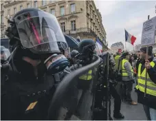  ?? EPA ?? It is unclear if France’s Yellow Vest protesters will respond positively to Mr Macron’s ‘national debate’