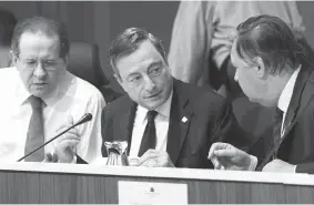  ??  ?? In this handout picture released by the European Central Bank, Mario Draghi ( center), president of the ECB, presides the Governing Council Meeting Malta 2015, on Thursday in Malta. The European Central Bank held its key interest rate steady on Friday,...