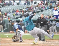  ?? PHOTO BY BERT HINDMAN ?? Bridgeport’s Wilkin Ramirez, right, beats the throw home to Blue Crabs catcher Angel Flores on Rossmel Perez’s sacrifice fly in the top of the second inning in the first game of Wednesday’s doublehead­er at Regency Furniture Stadium in Waldorf. The...